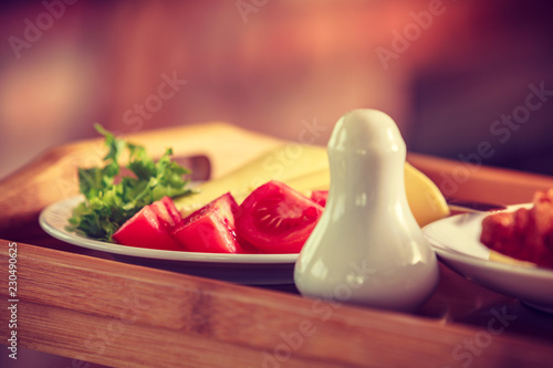 Tomatoes, lettuce and cheese served on plate