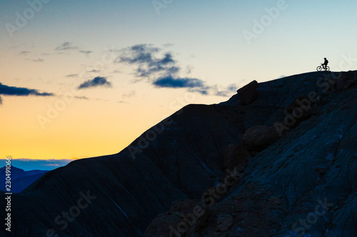 Biker on top of mountain, Green River, Utah, USA