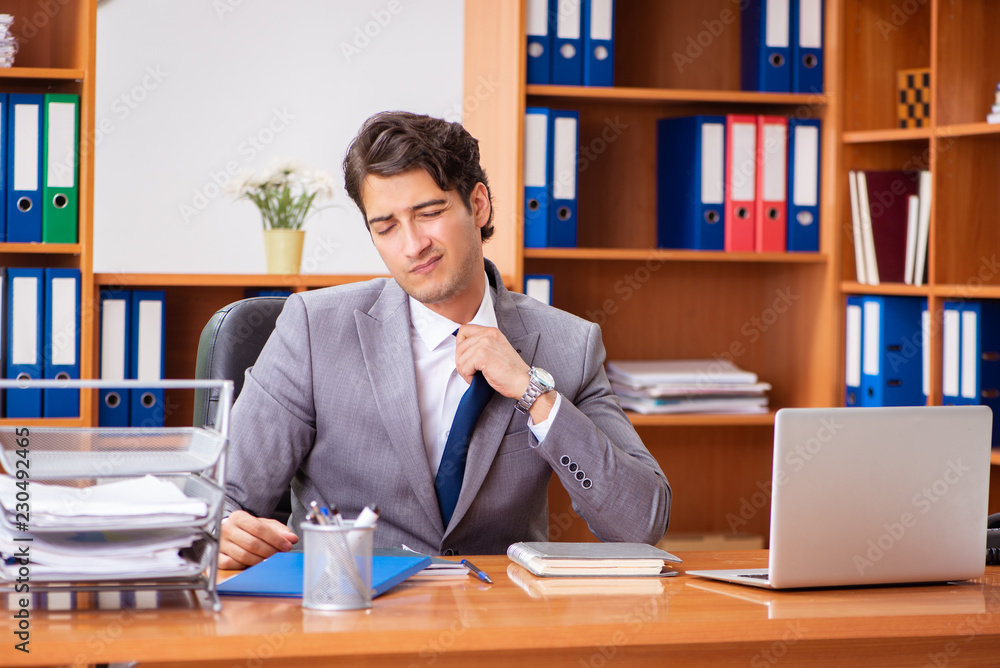 Young employee working in the office Young employee working in the office