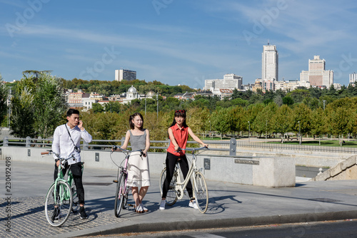 Asian people with bicycles photo