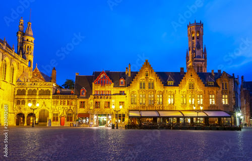 Burg square with Basilica of the Holy Blood and Belfort tower at background at night, Bruges, Belgium