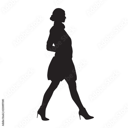 Businesswoman walking in high heels shoes and mini skirt, side view, isolated vector silhouette. Business people, model