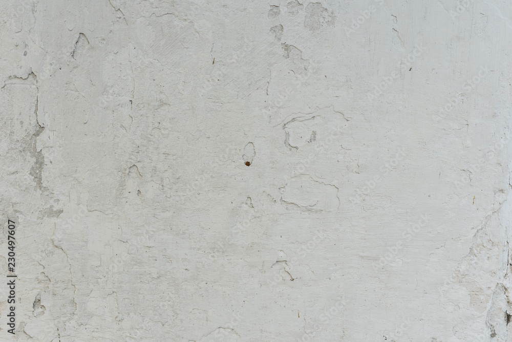 Fototapeta premium Wall fragment with scratches and cracks. It can be used as a background