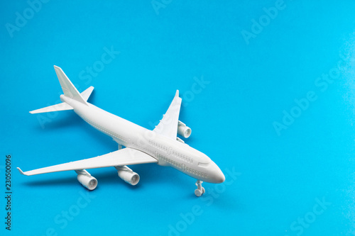 Model plane, airplane on blue background. travel and transportation idea.