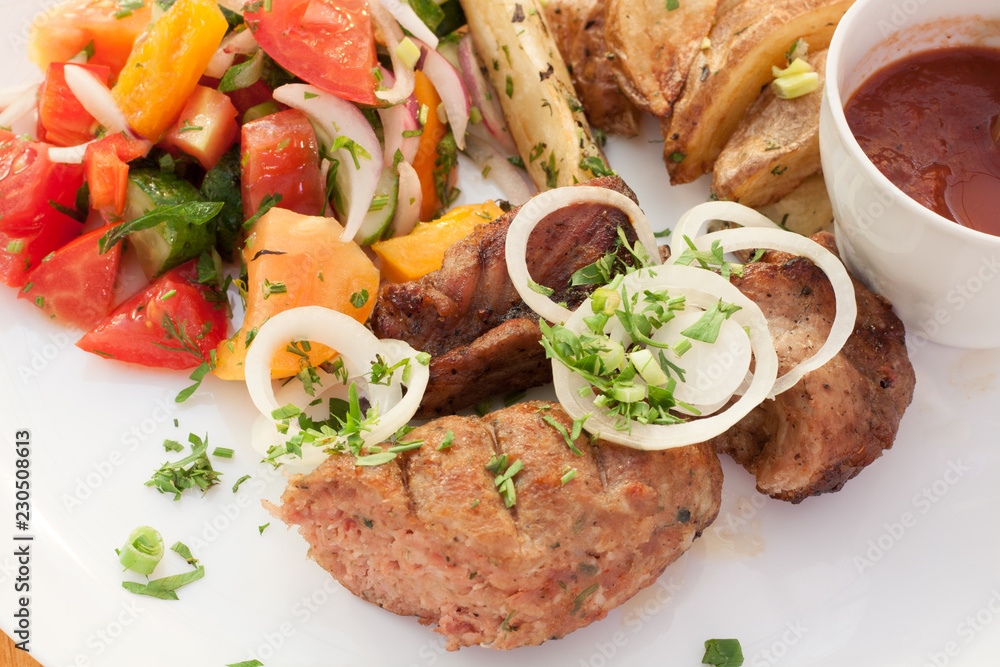 barbecue meat dishes potatoes vegetables and sauce barbecue meat dishes potatoes vegetables and sauce