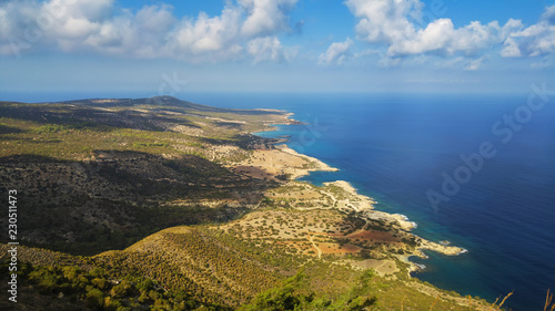 View from above to the Cyprus island sea coast with blue water and lagoons. Akamas cape landscape. Natural seasonal summer vacation background.