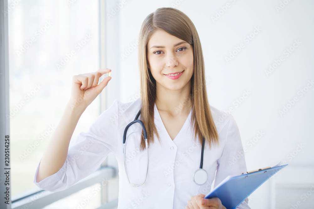 Portrait of young doctor standing in medical office Portrait of young doctor standing in medical office