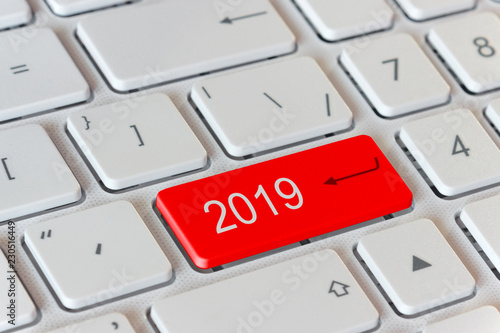 on the keyboard is a red button with the number 2019