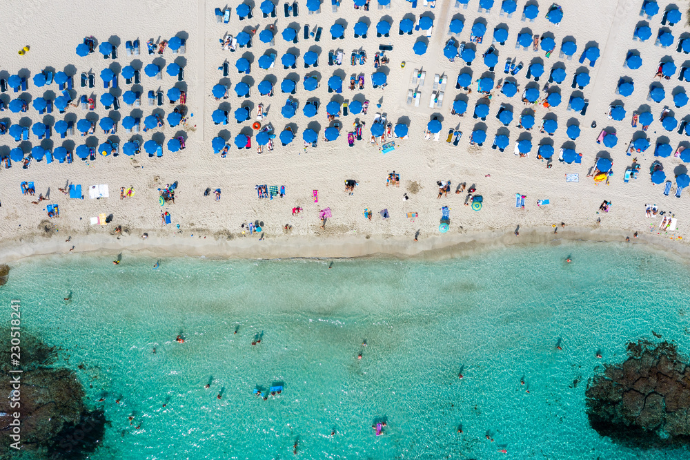A drone photograph of a beach full with umbrellas in Ayia Napa