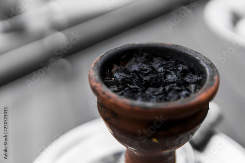 Tobacco for hookah in a clay bowl for shisha smoke. photo