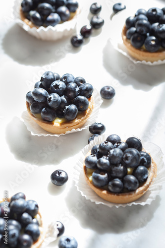 Blueberry tarts on marble photo