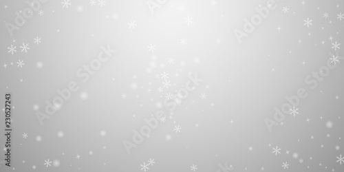 Sparse glowing snow Christmas background. Subtle f