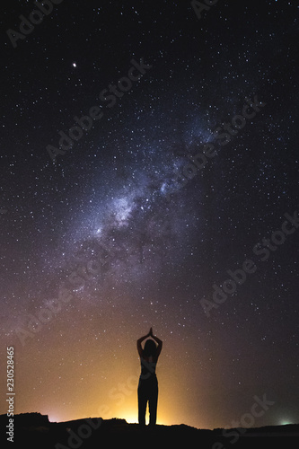 silhouette of woman in the night sky