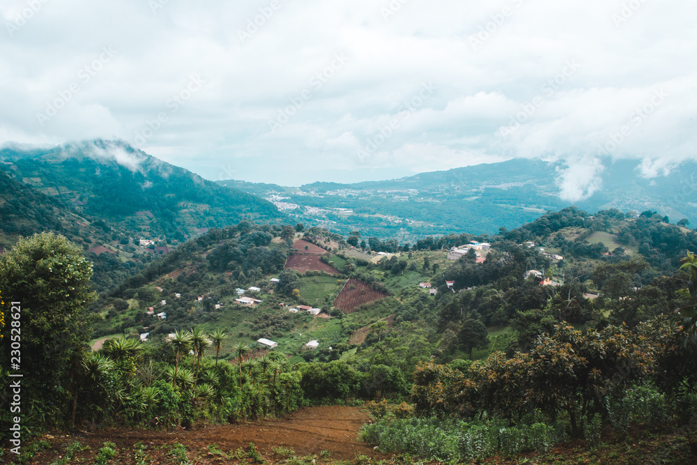 Views over the green hilly landscape worked into small farms in the rural mountains of Guatemala Views over the green hilly landscape worked into small farms in the rural mountains of Guatemala