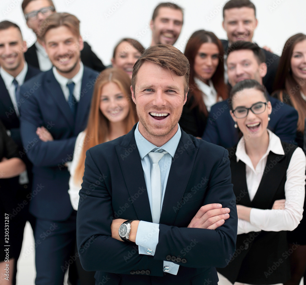 smiling businessman standing on background of her business team. smiling businessman standing on background of her business team.
