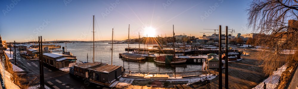 Sunset over sailboats in the marina of Oslo, Norway