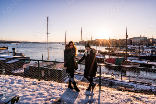 Photography Women tourists in Oslo, Norway at sunset.  Winter