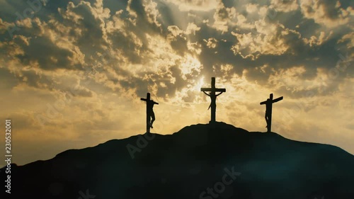 Calvary hill outside ancient Jerusalem where Jesus Christ was crucified. Three silhouettes of Crosses with mystical clouds and rays of light. photo