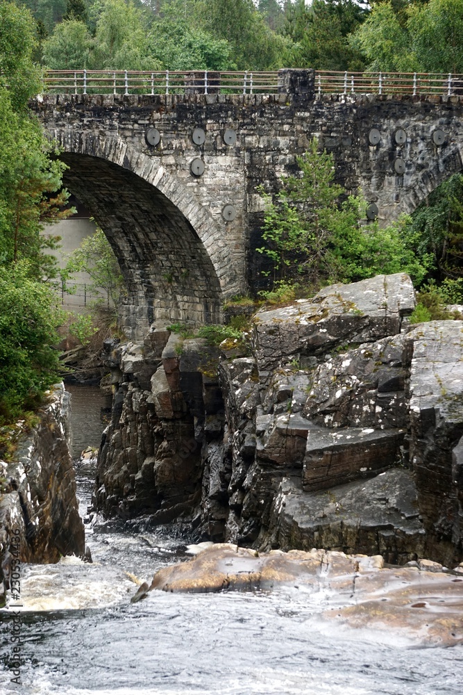 Garve, Scotland: The Victorian-era Little Garve Bridge over Black Water, a river in the Scottish Highlands.