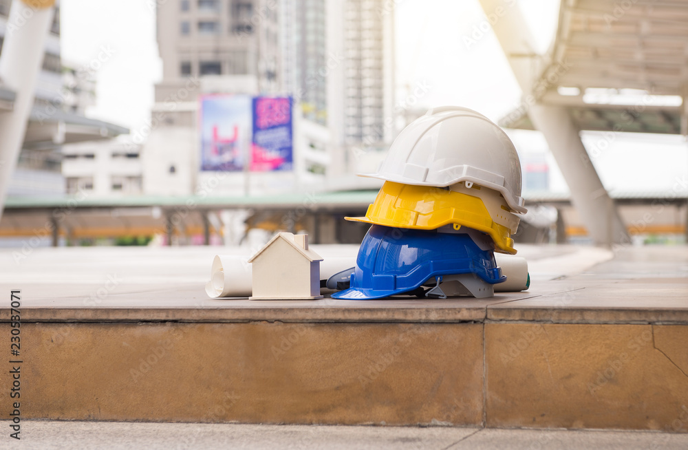 Hard hats safety helmet with home model,blueprint,Construction and Engineer Hard hats safety helmet with home model,blueprint,Construction and Engineer