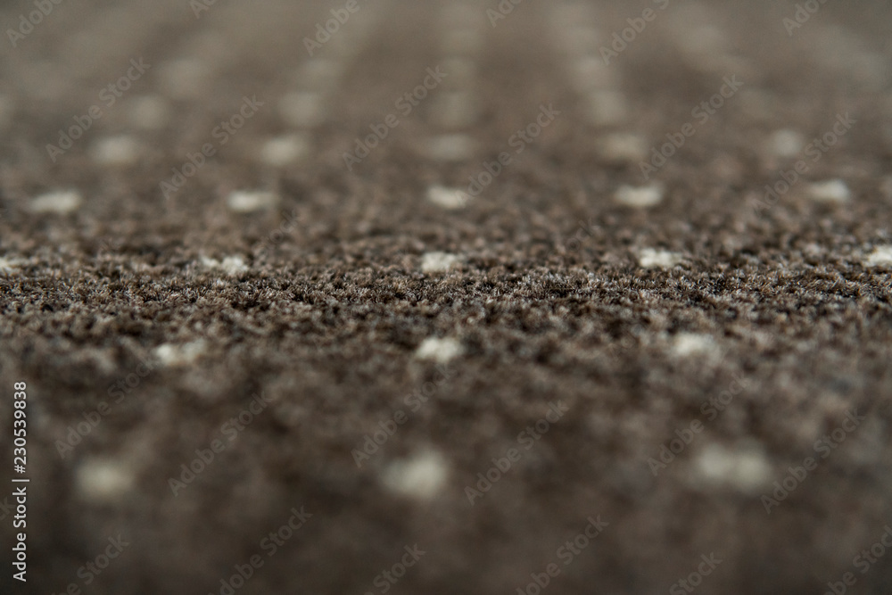 Brown carpet with a white dots texture. Indoor carpeting shoot in daylight. Brown carpet with a white dots texture. Indoor carpeting shoot in daylight.