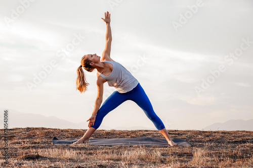Young Athletic Woman Doing Yoga Stretching