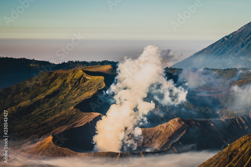 Mount Bromo volcano  Gunung Bromo   and Batok during sunrise from viewpoint on Mount Penanjakan  in East Java  Indonesia. Early morning.