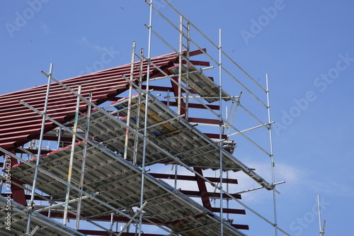 Construction workers working on scaffolding