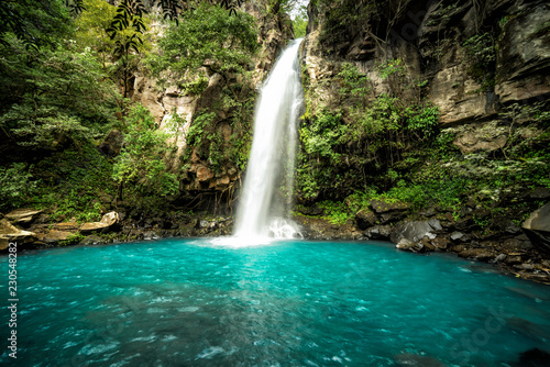 Majestic waterfall in the rainforest jungle of Costa Rica. La Cangreja waterfall in Rincon de La Vieja National Park, Guanacaste © nick