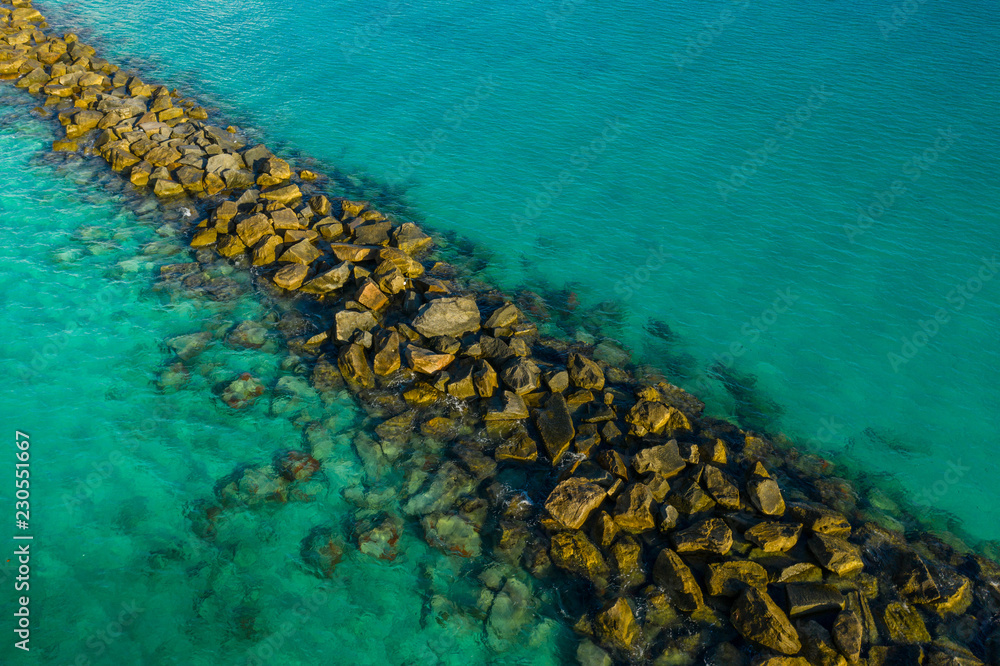 Tropical Waters and rock jetty
