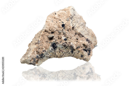 Mineral pegmatite with splashes of morion crystals on white background