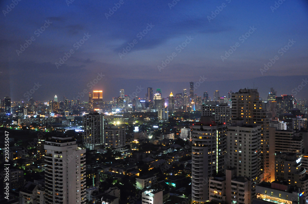 The night scene of Bangkok cityscape skyline in sukhumvit area. Photo from rooftop bar. The night scene of Bangkok cityscape skyline in sukhumvit area. Photo from rooftop bar.