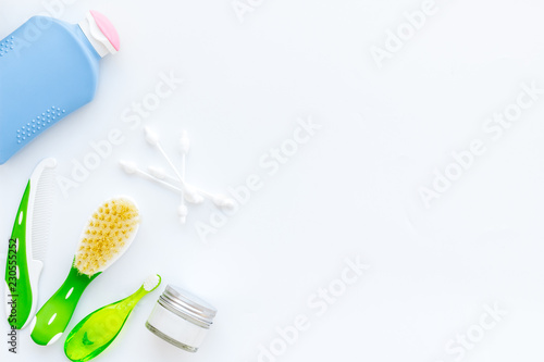 Children's personal care kit. Bath accessories with teeth brush on white background top view copy space