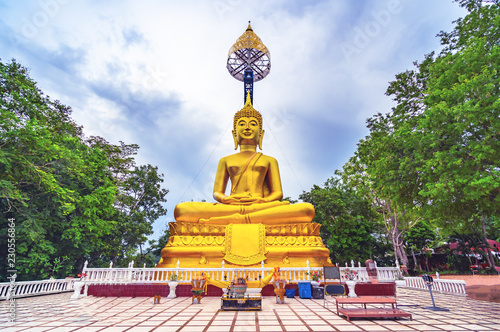 Buddha statue named Suphatthara Bophit Buddha at Khao Kradong Forest Park in Buriram province of Thailand photo