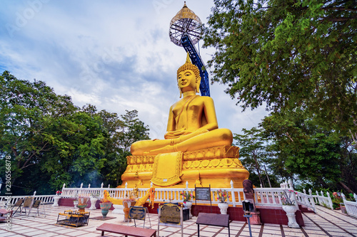 Buddha statue named Suphatthara Bophit Buddha at Khao Kradong Forest Park in Buriram province of Thailand photo