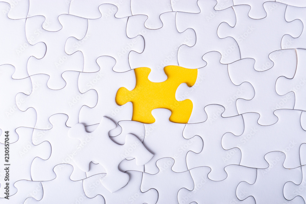 White jigsaw puzzle with selective focus and crop fragment White jigsaw puzzle with selective focus and crop fragment