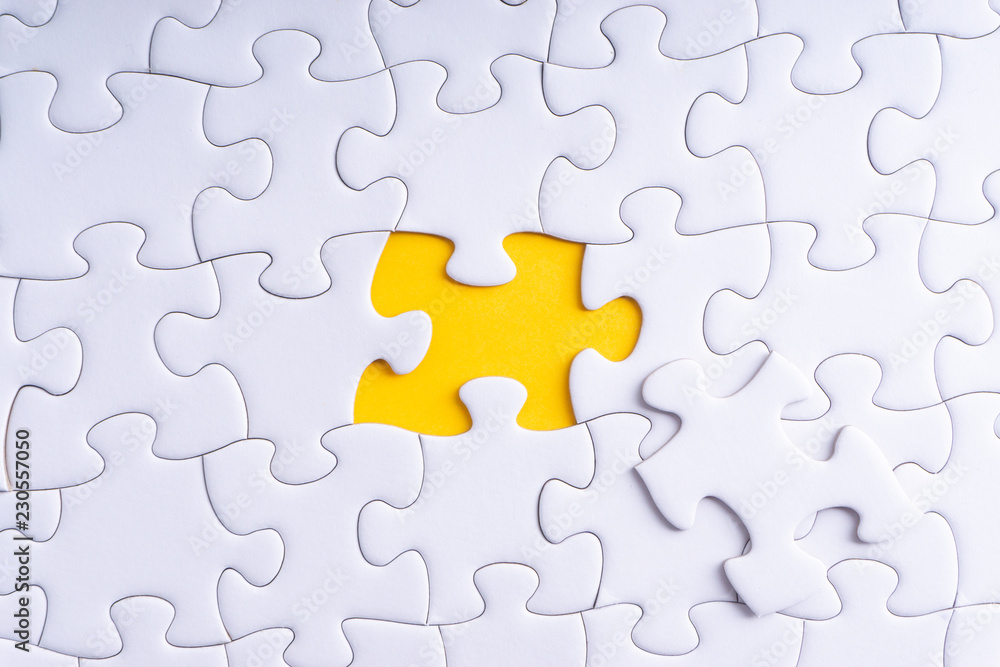 White jigsaw puzzle with selective focus and crop fragment White jigsaw puzzle with selective focus and crop fragment