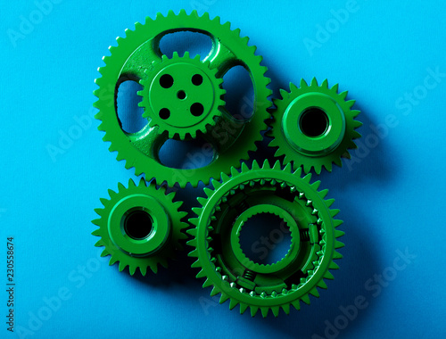 gears mechanism green bright technology blue background
