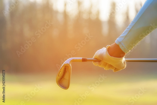 Close up hand golfer. Women player golf holding clubs for warm up and relax body before play game, copy space. Lifestyle Concept