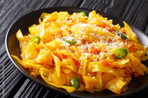 Cabbage Bhaji is a spiced stir fry from Goa, India closeup on a plate. horizontal photo