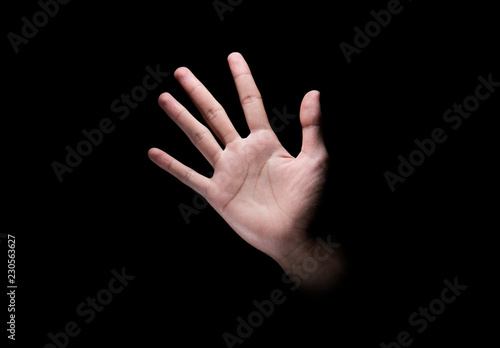 Male hand with open palm or five finger sign