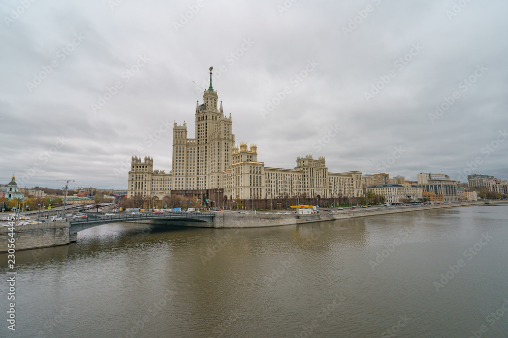 Moscow city image at the cloudy autumn day. The Stalin era house is very massive building Moscow city image at the cloudy autumn day. The Stalin era house is very massive building