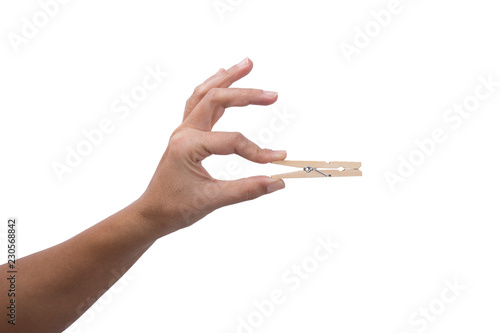 Hand holding Wooden Clothes Peg 