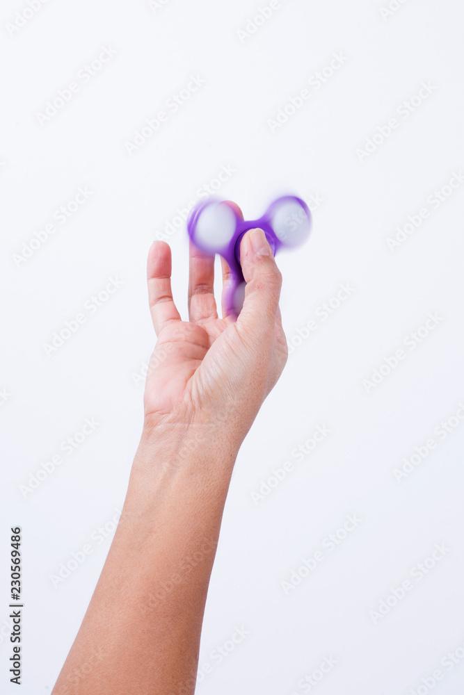 holding the fidget spinner holding the fidget spinner
