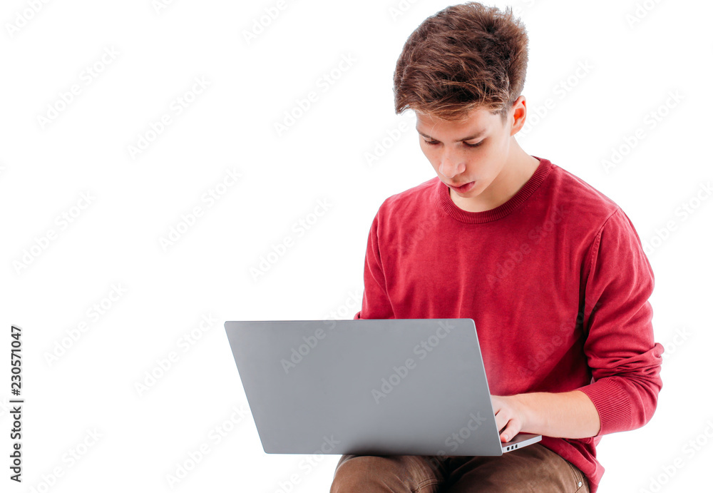 Teenager student working at laptop on white background, isolated Teenager student working at laptop on white background, isolated