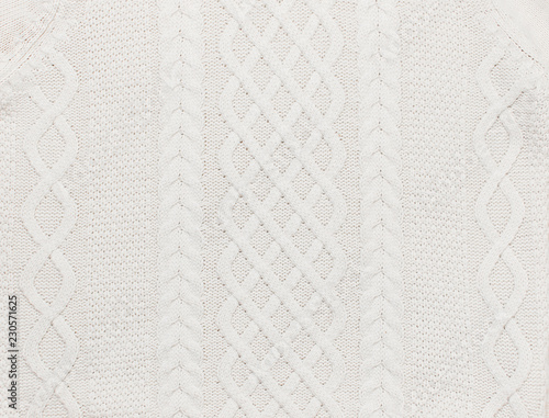White knitting wool texture background. Knitted texture. Pattern fabric made of wool. Handmade sweater texture, knitted wool pattern