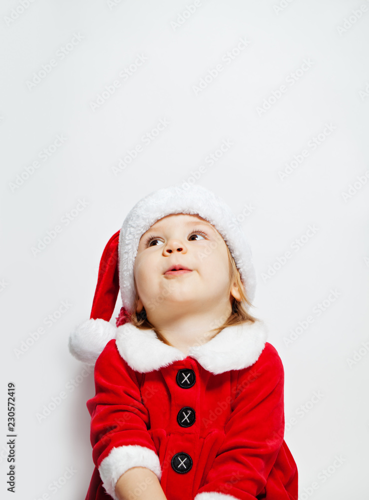 Cute baby in santa hat opening Christmas gift box Cute baby in santa hat opening Christmas gift box