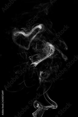 abstract white smoke in the air on a black background