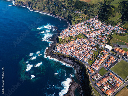 Aerial view of the ocean surf on the reefs coast of San Miguel island, Azores, Portugal.