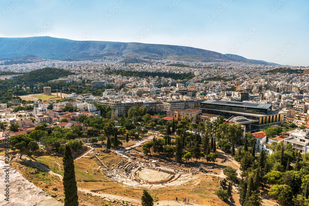 Athens city panorama with ancient ruins of   amphitheater on foreground.
